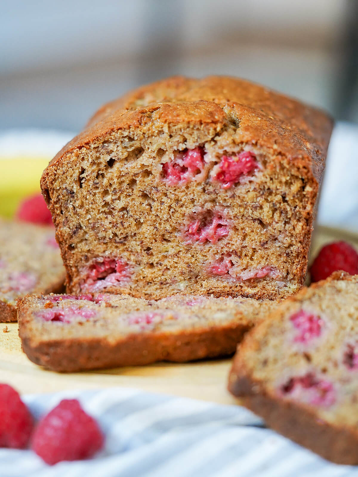side on view of loaf of raspberry banana bread.
