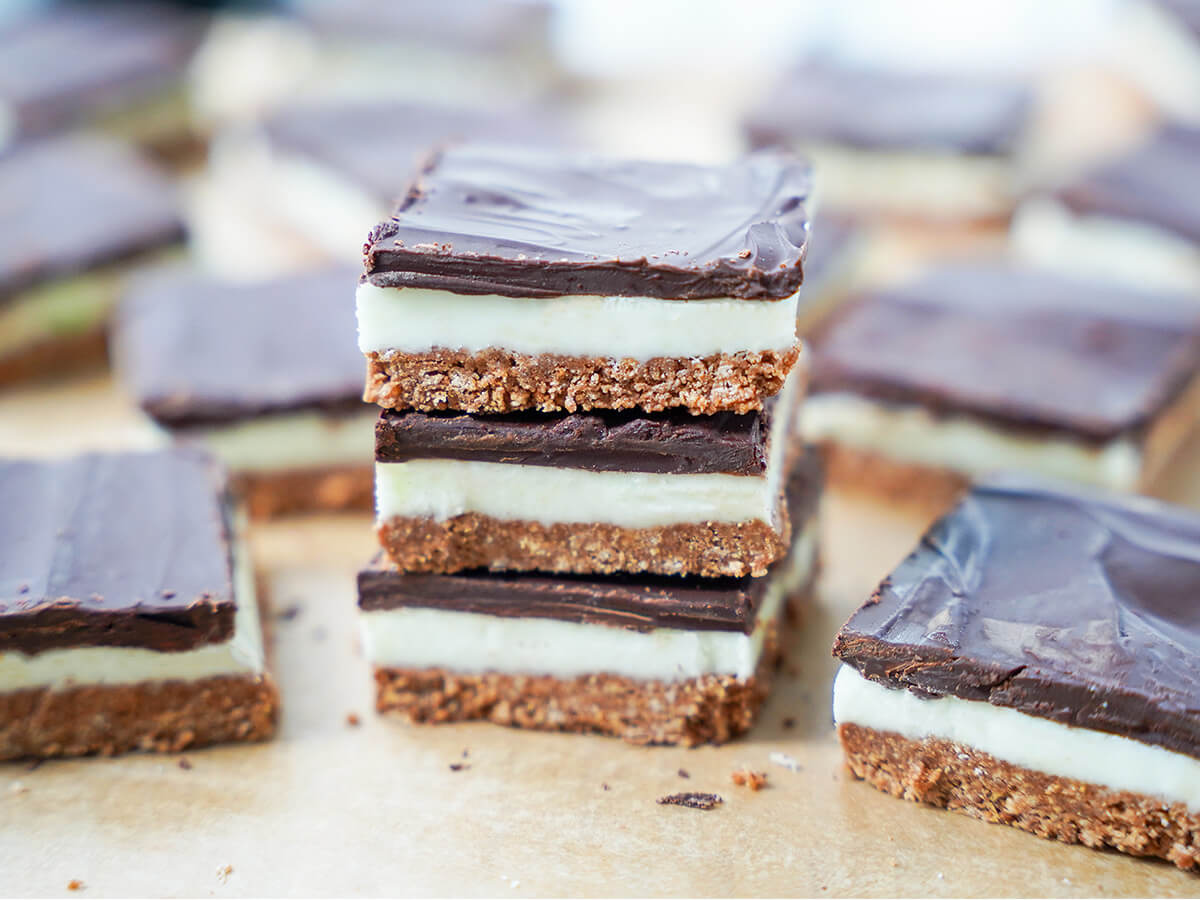 stack of three pieces of peppermint slice with other slices to side and behind.
