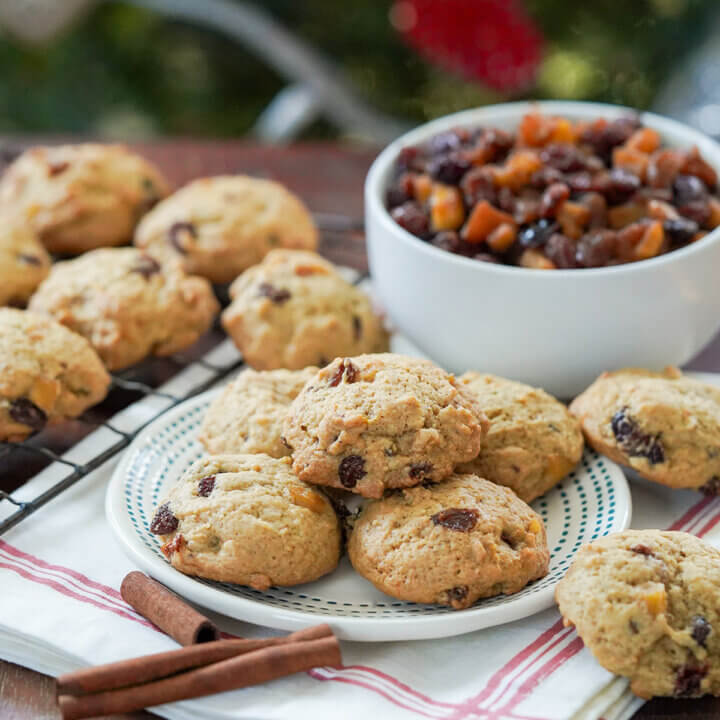 plate with mincemeat cookies with a bowl of mincemeat behind.