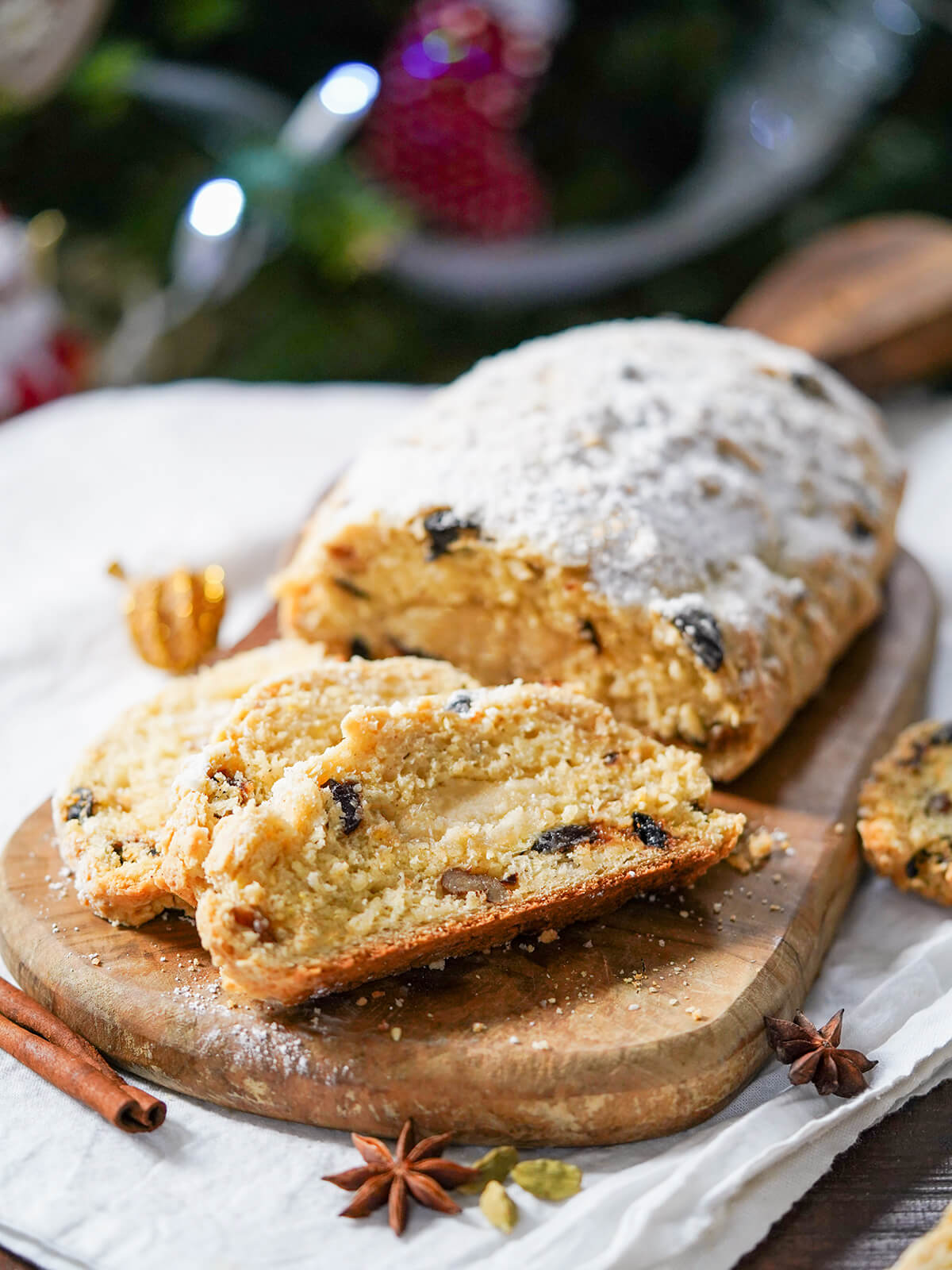 slices of quark stollen in front of loaf on board.