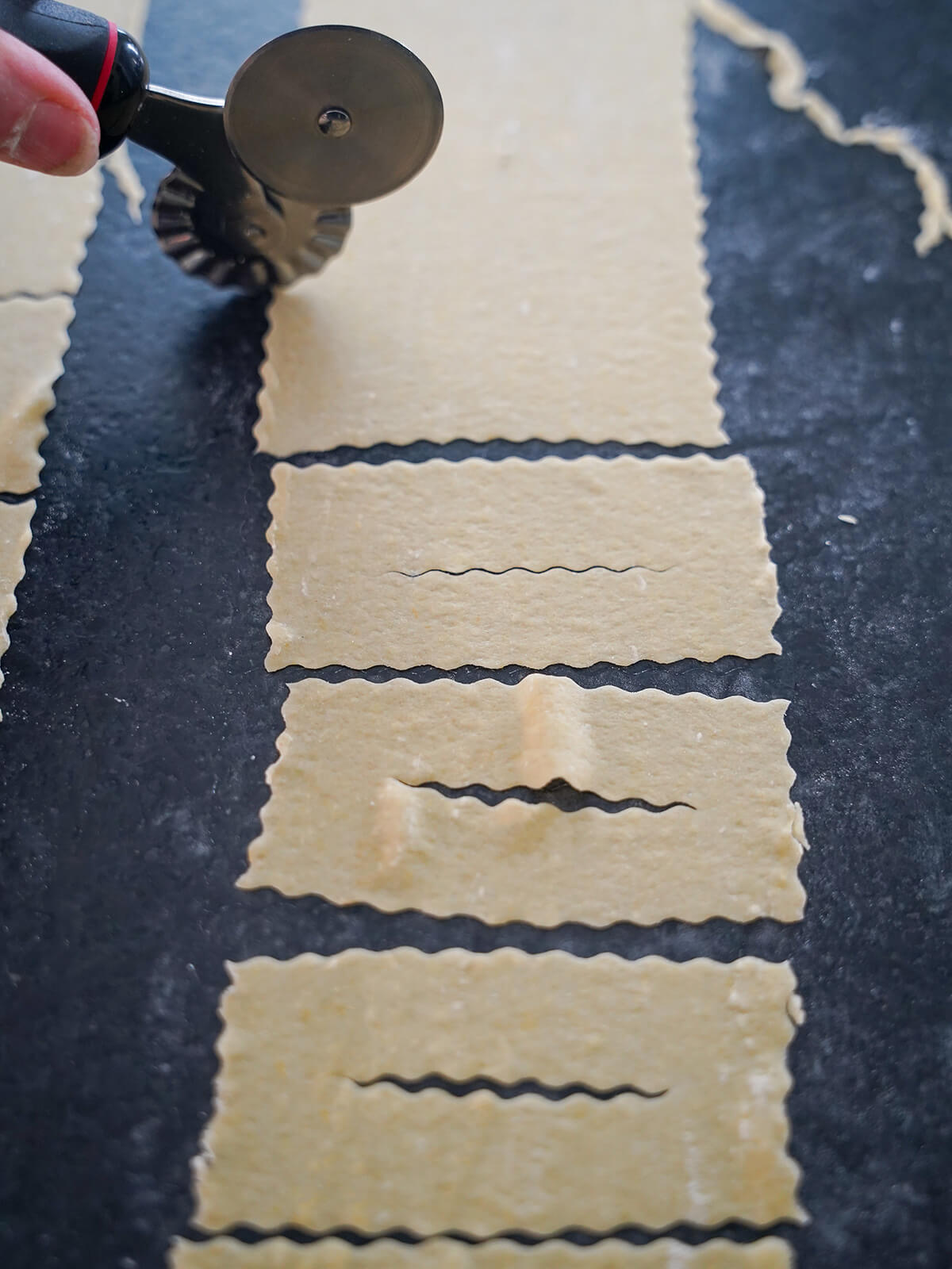 cutting and scoring split in chiacchiere fried pastries with ravioli cutter