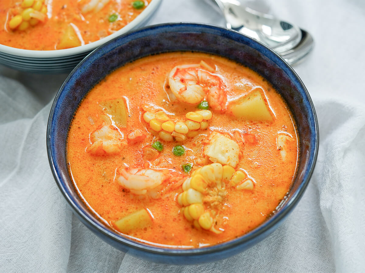 bowl of chupe de camarones, Peruvian shrimp chowder.