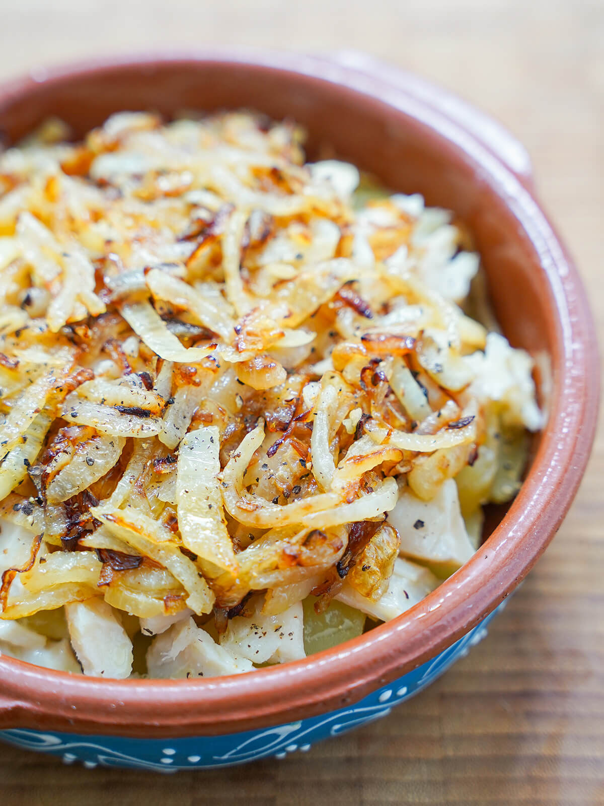 potato, salt cod and cooked onions layered up in dish before finishing in oven.