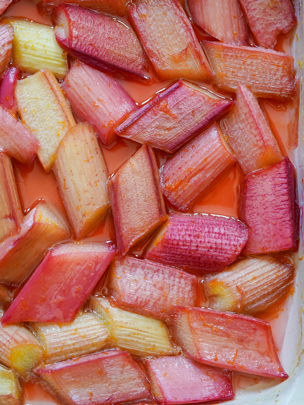 close overhead view of roasted rhubarb in baking dish.