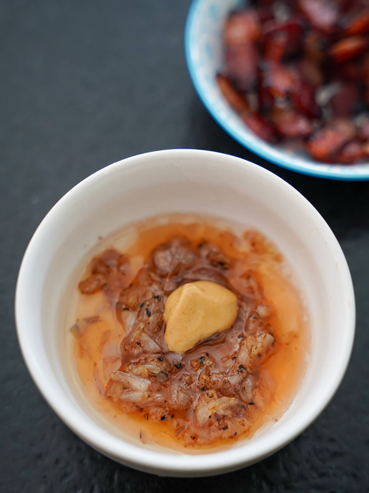 ingredients for shallot vinaigrette in small bowl before mixing.