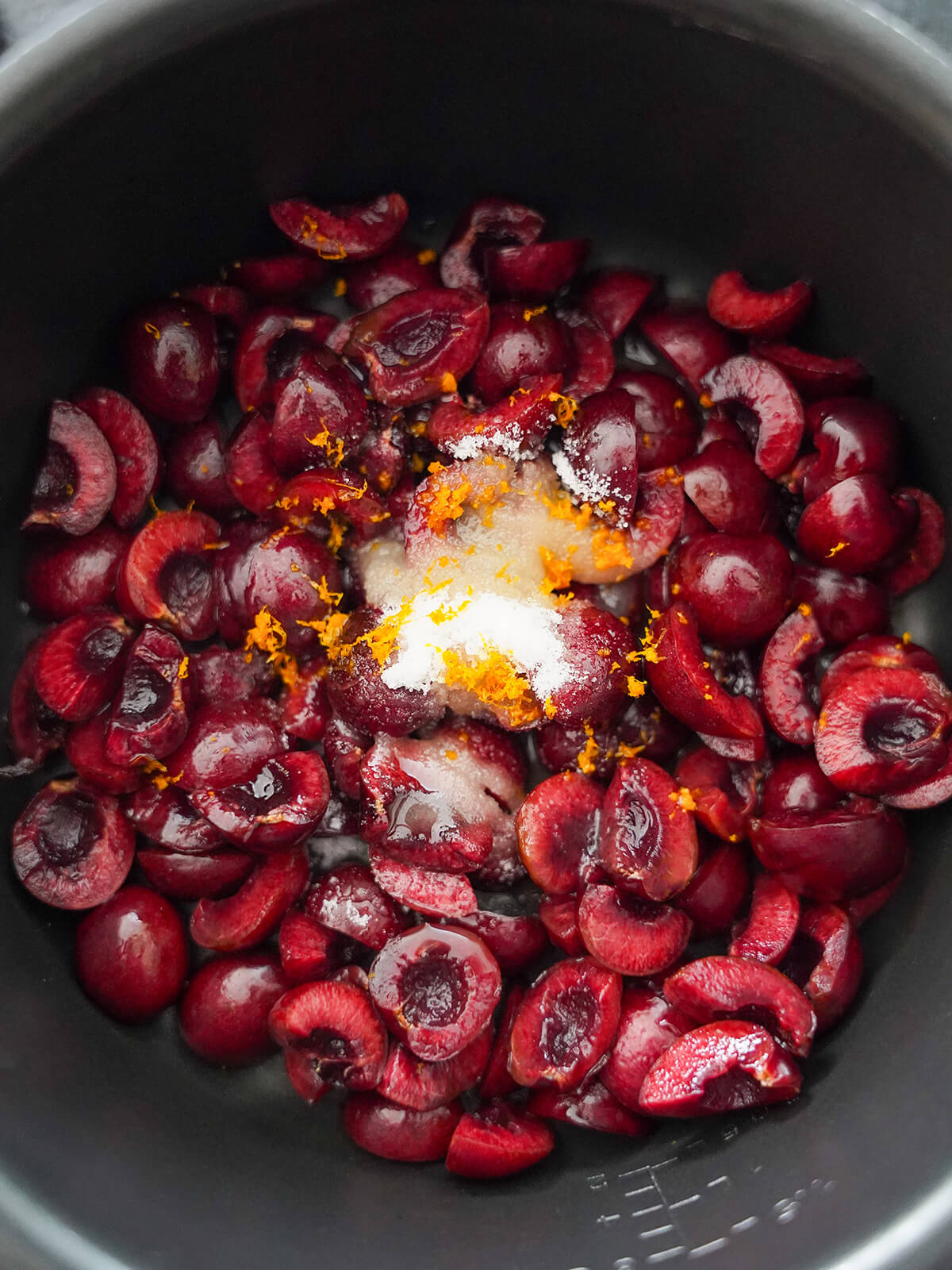 chopped cherries with sugar and orange zest on top.