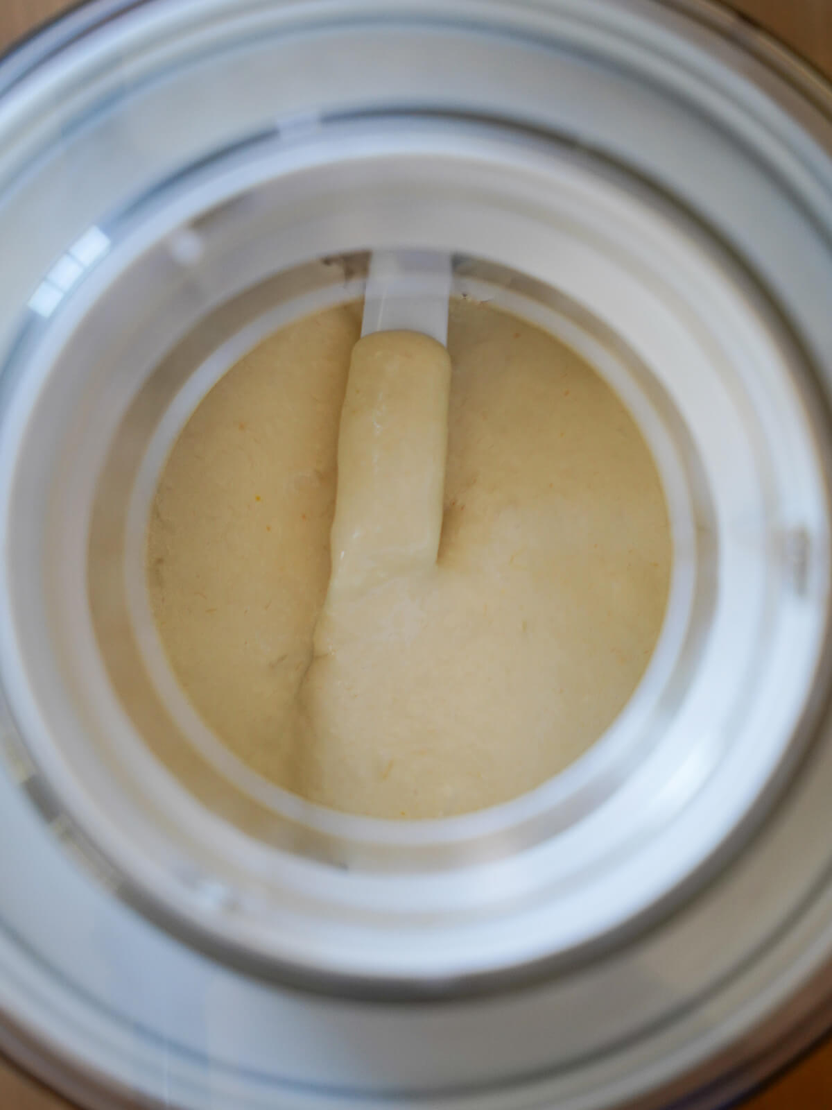 rhubarb ice cream churning in ice cream maker.
