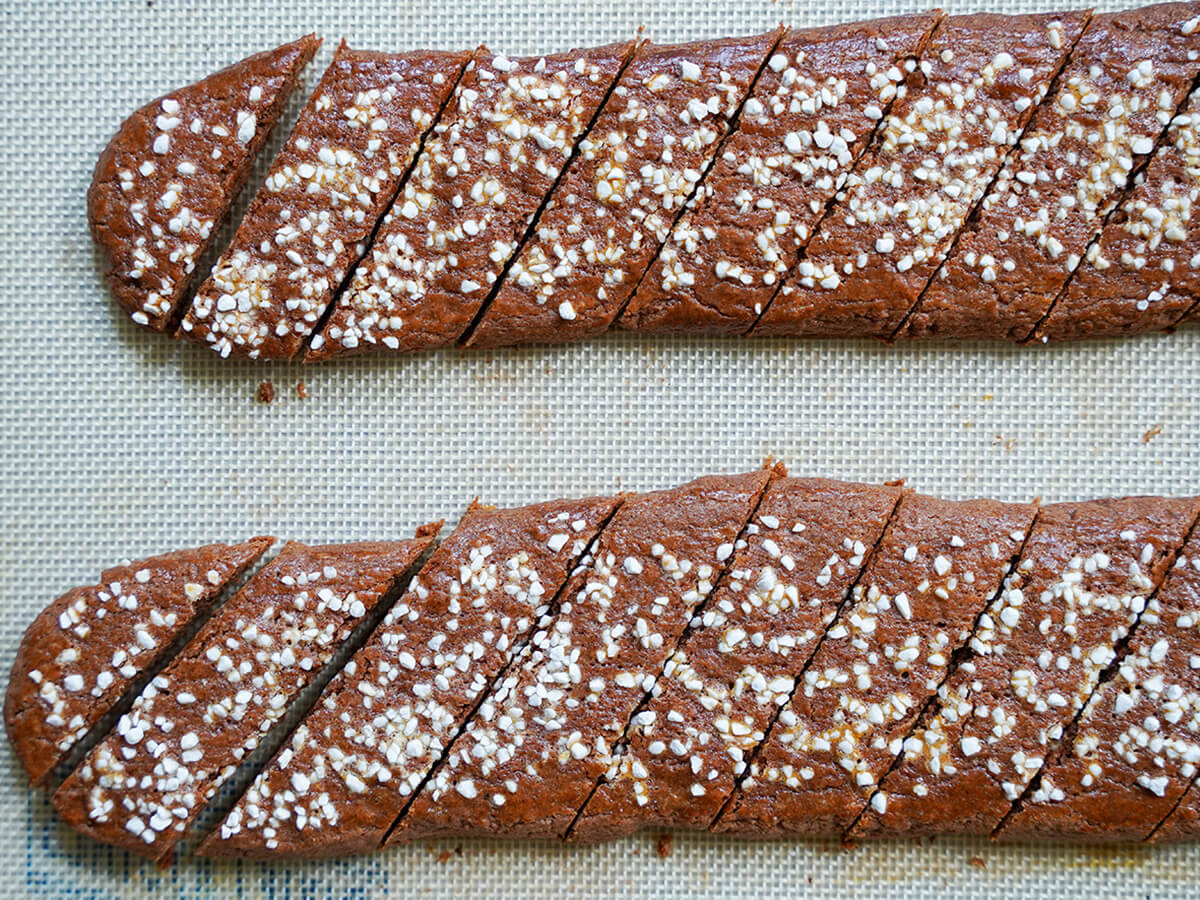 slicing baked chokladsnittar, Swedish chocolate cookies on baking mat.
