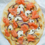 close overhead view of smoked salmon pizza.