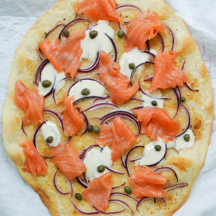 close overhead view of smoked salmon pizza.