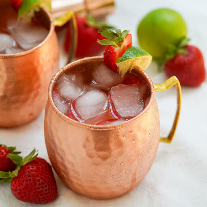 copper mug filled with strawberry Moscow mule.