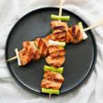 plate of teriyaki salmon skewers from overhead.