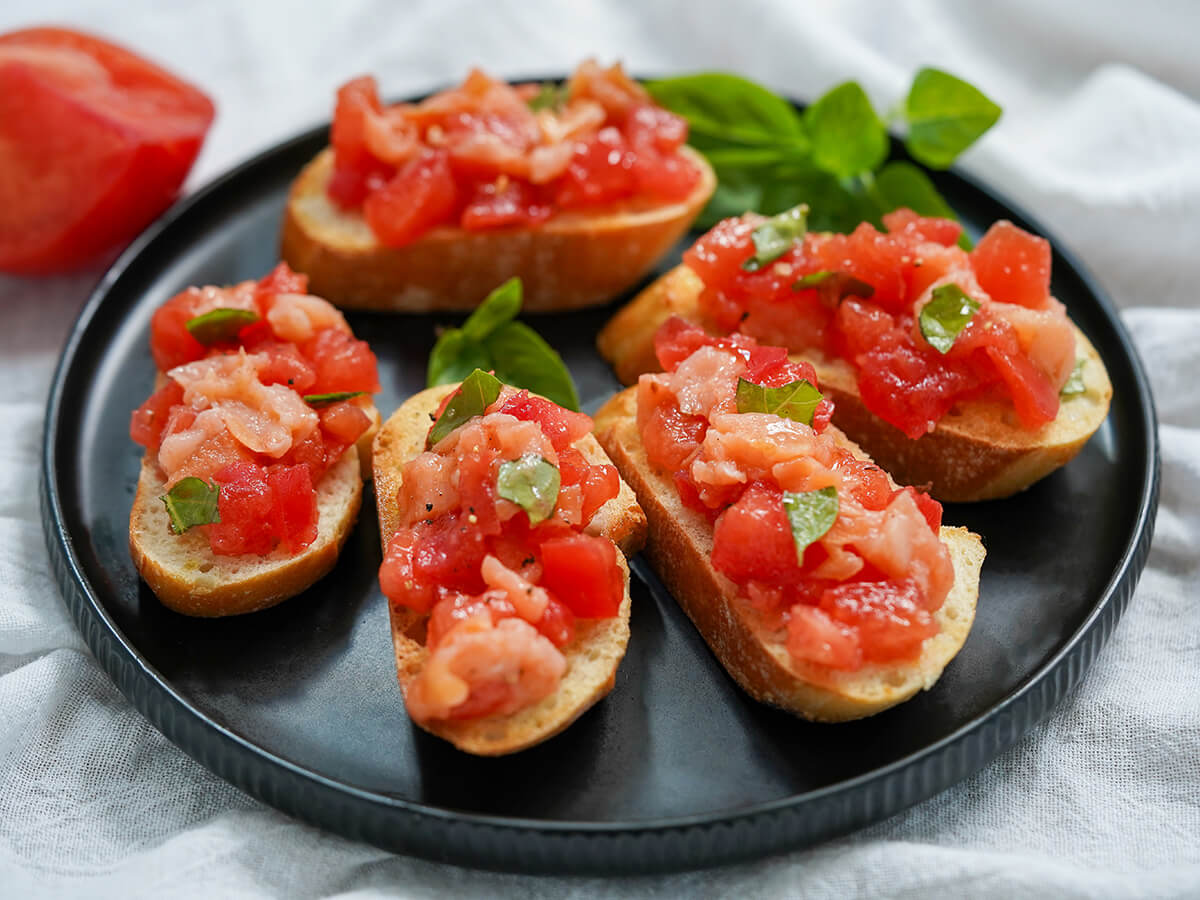 side view of plate of smoked salmon bruschetta.