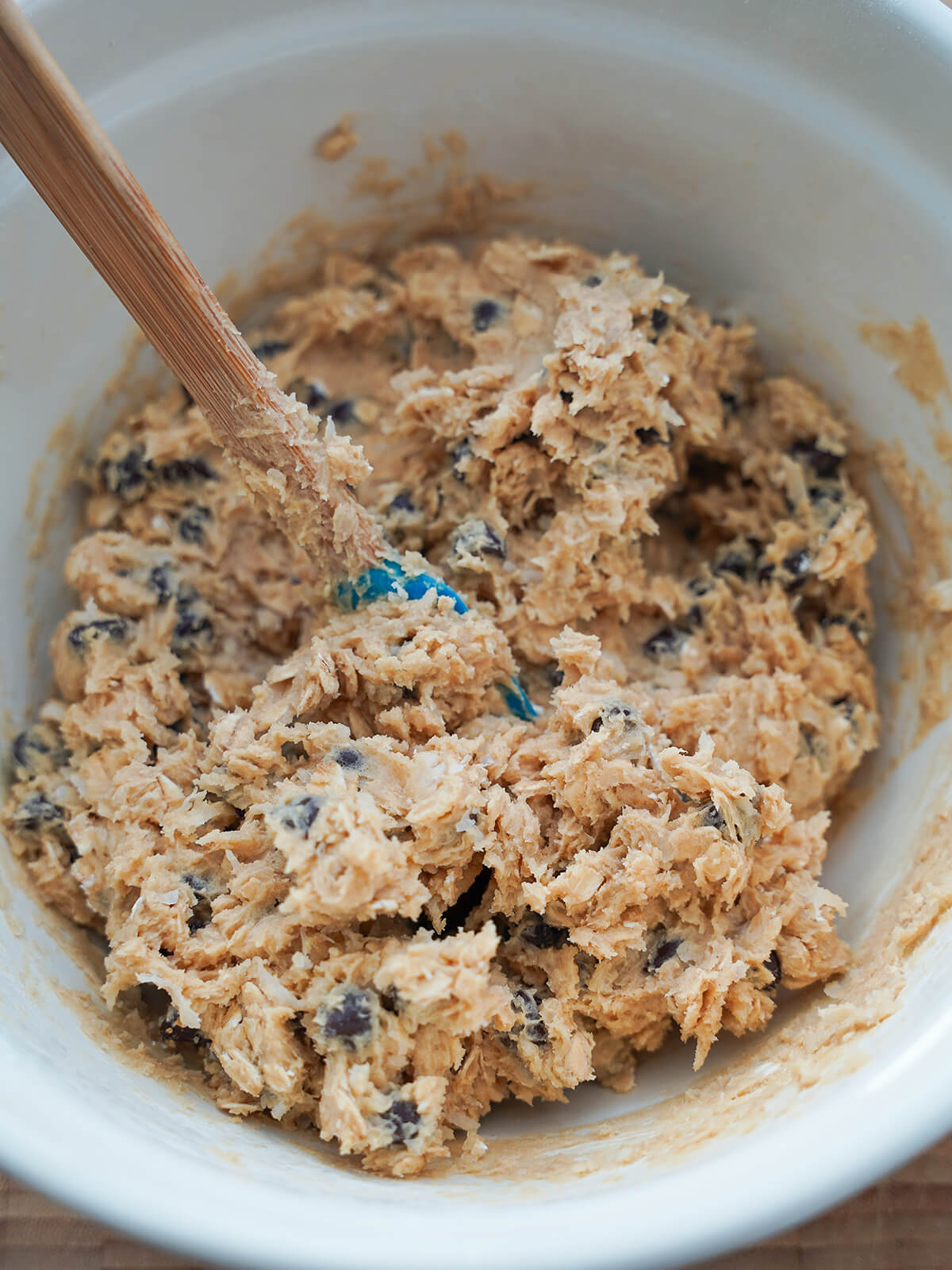 bowl of cookie batter with spatula in it.