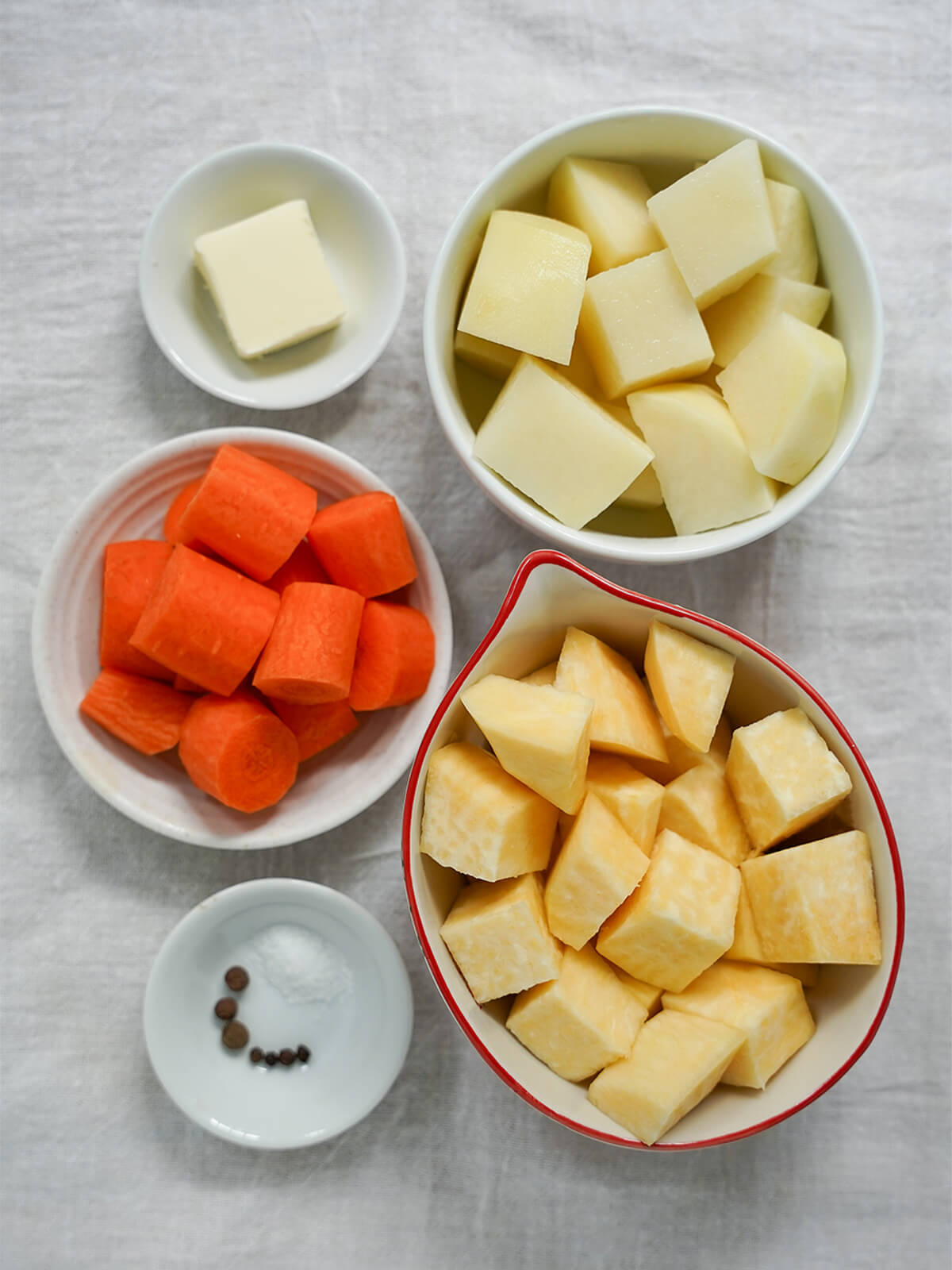 dishes with diced potato, carrot and rutabaga.