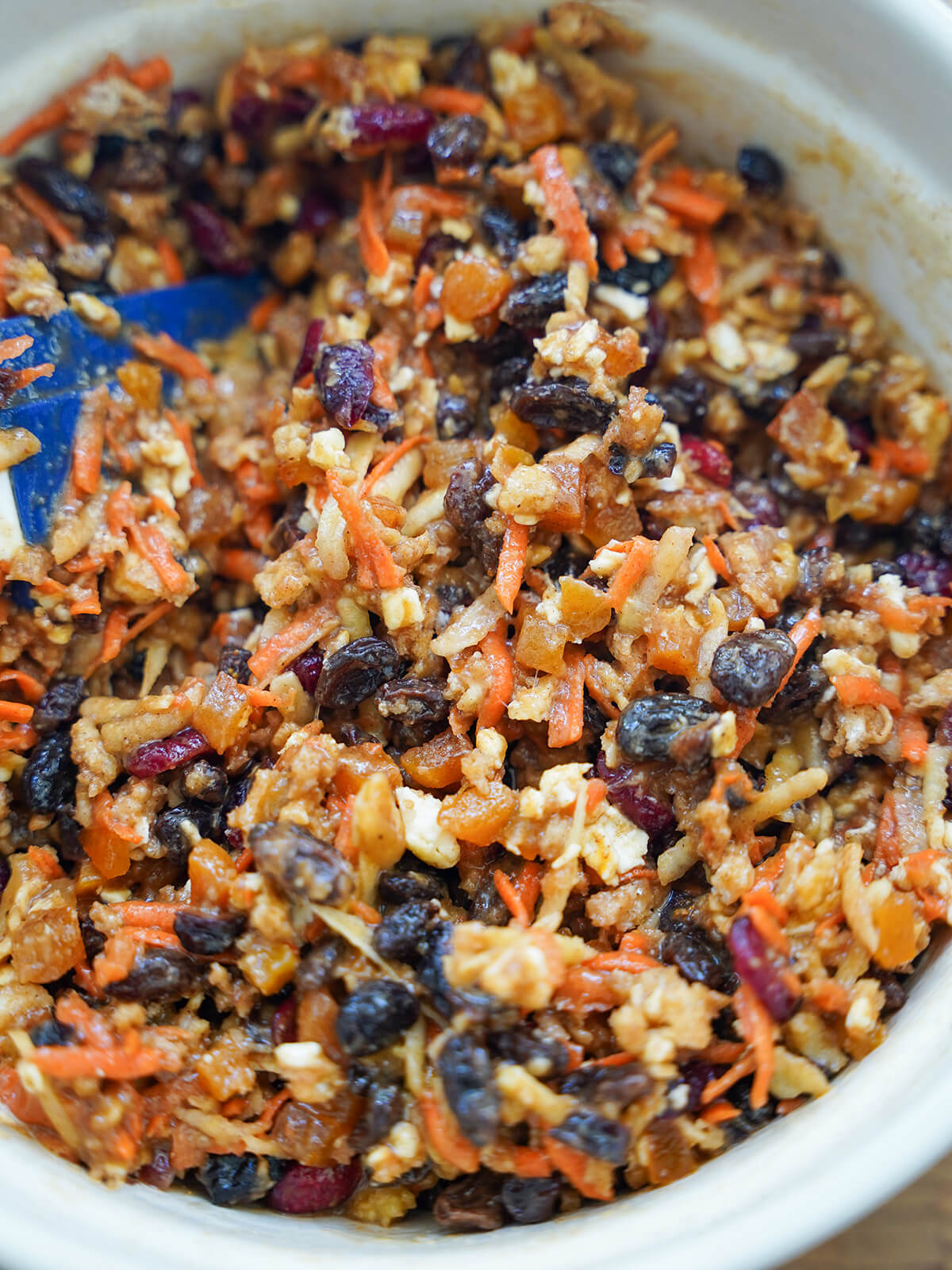 mixing Christmas pudding ingredients in bowl.