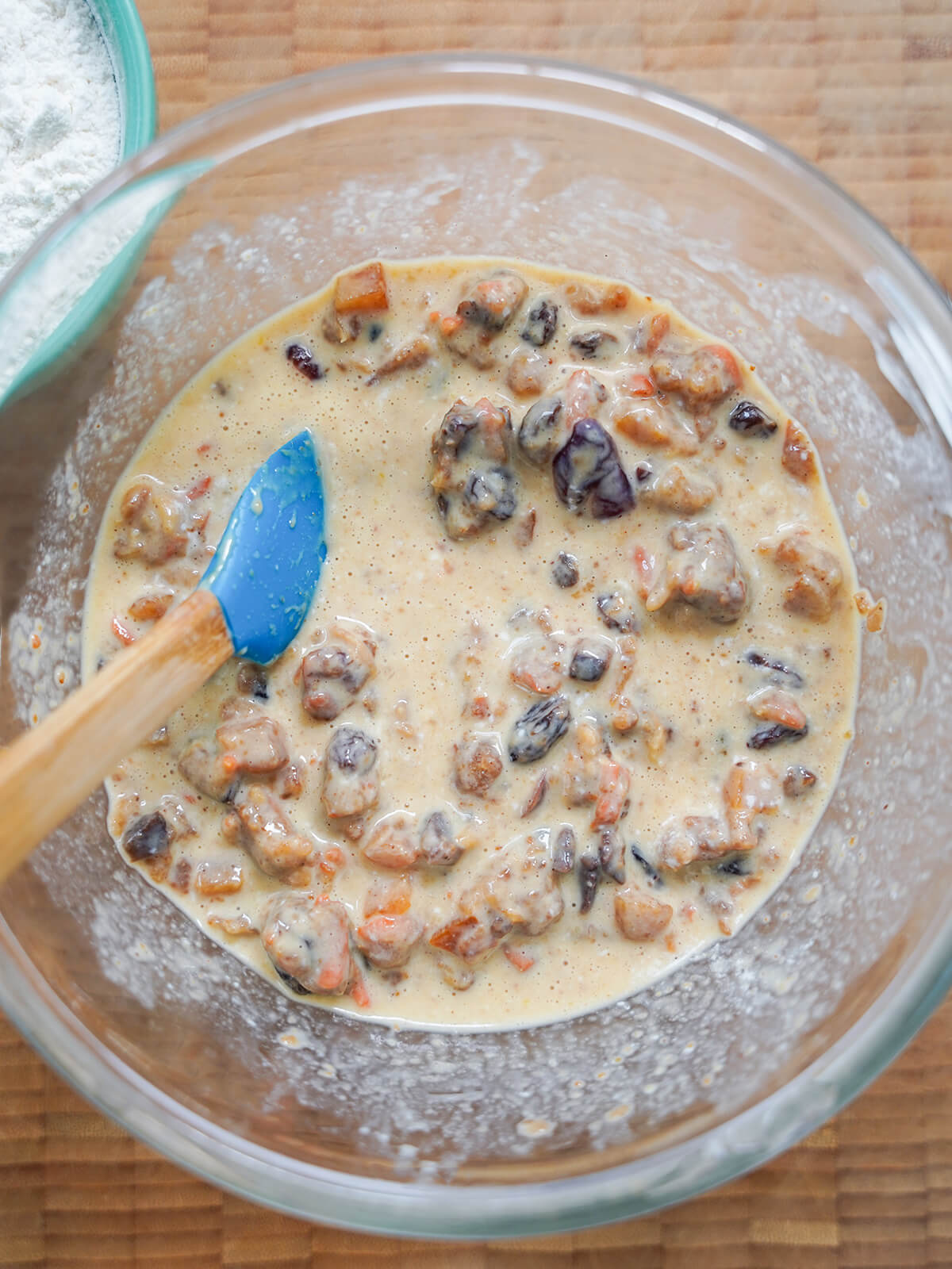 broken up pudding in bowl with milk and egg.