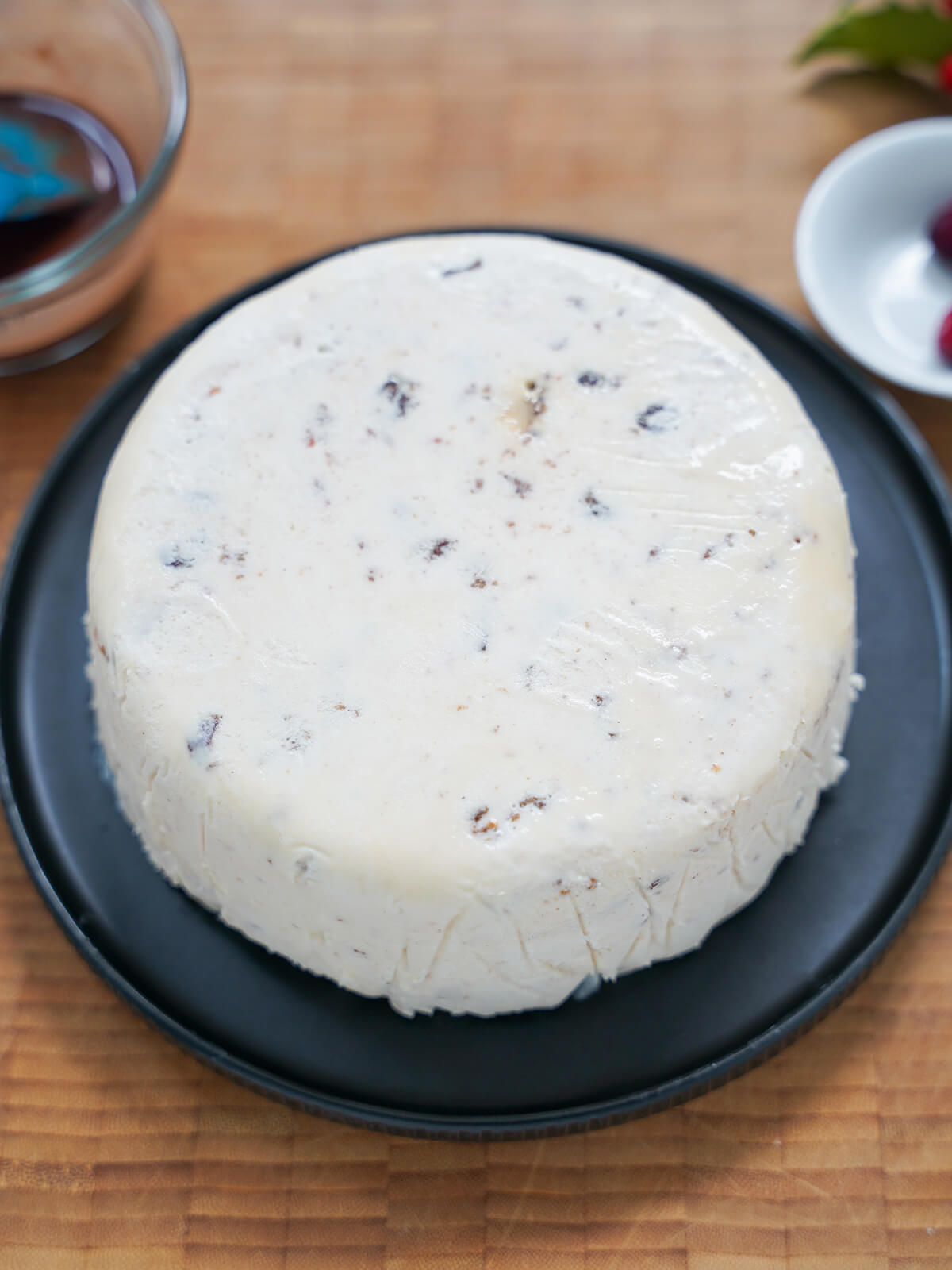 Christmas pudding ice cream block turned out on plate.