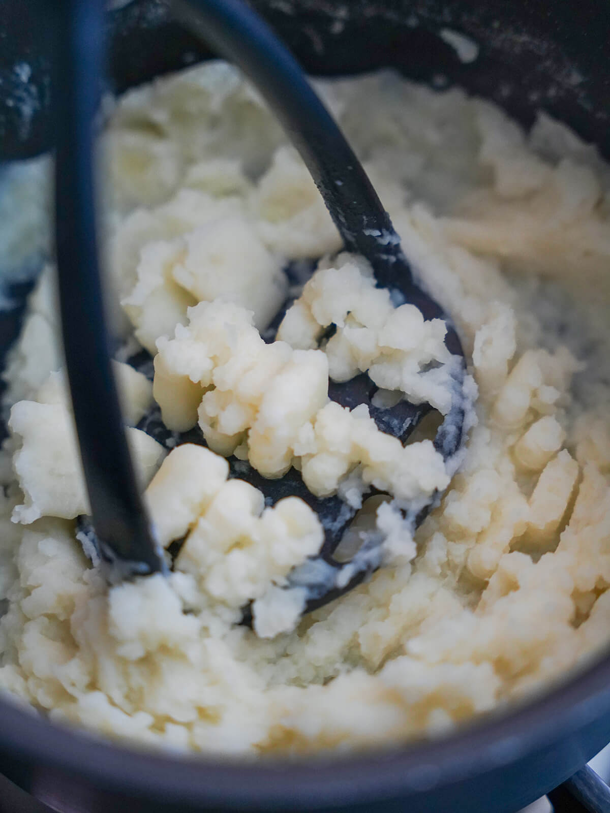 mashing potato to a smooth consistency.