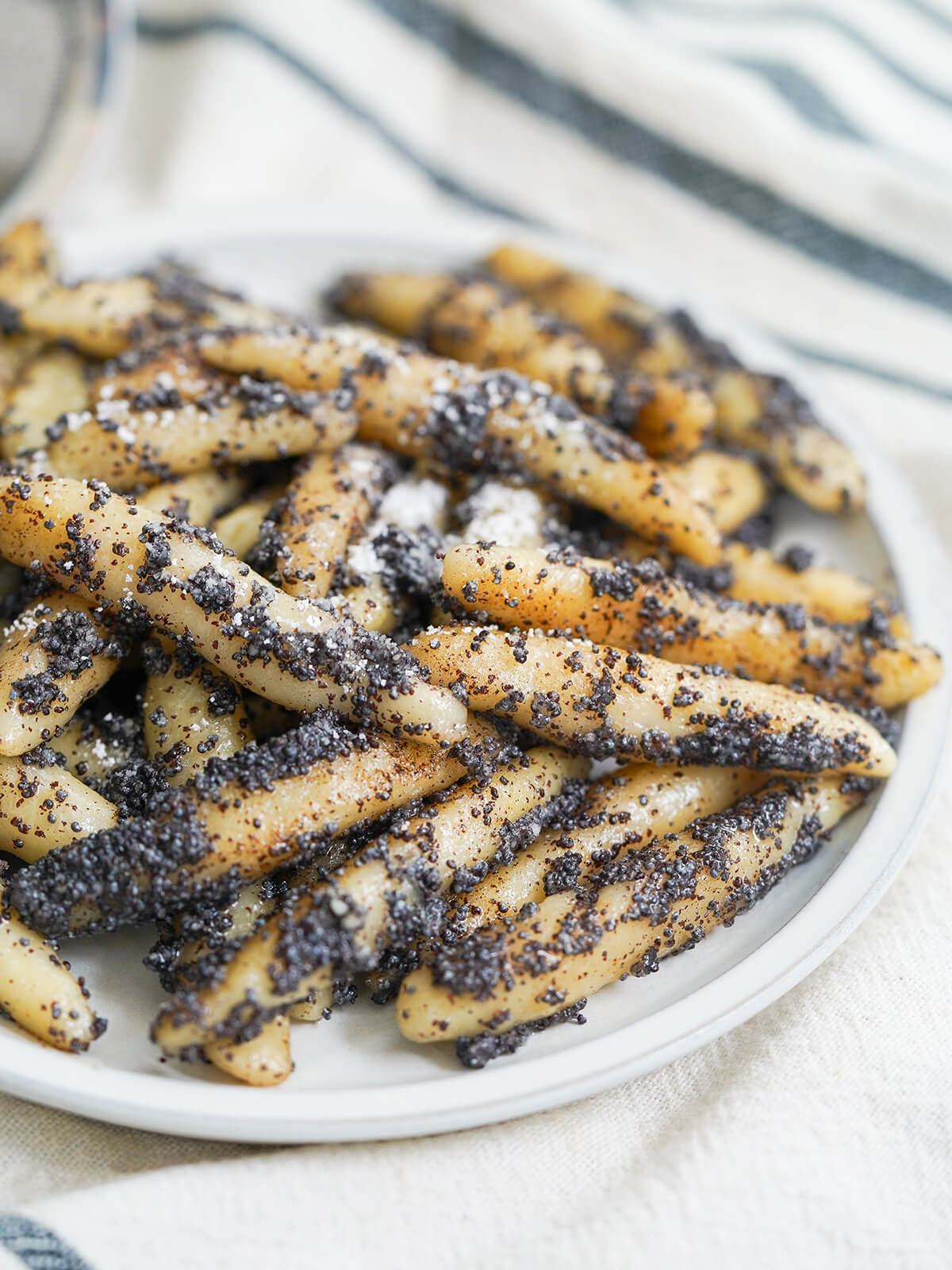 side part view of plate of Mohnnudeln, poppy seed potato noodles.
