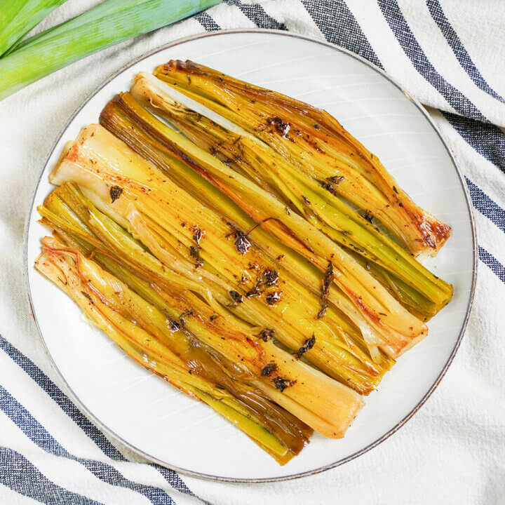 overhead view of a plate of braised leeks.
