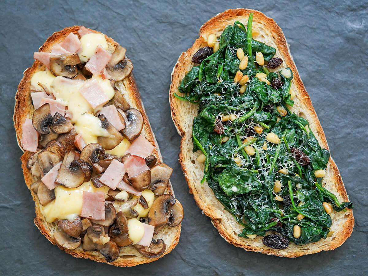 two llescas, Catalan loaded toasts, with different toppings side by side.